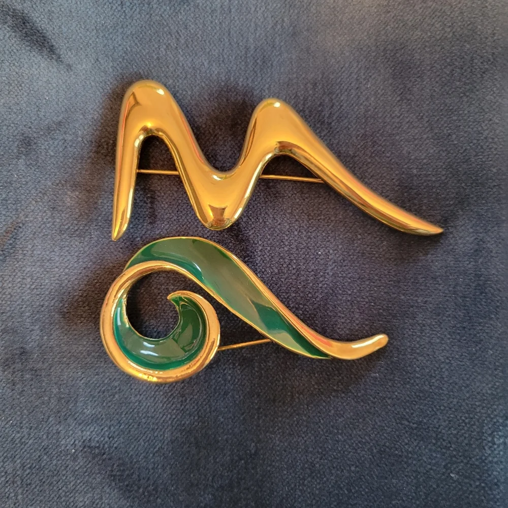 Trifari trio brooches